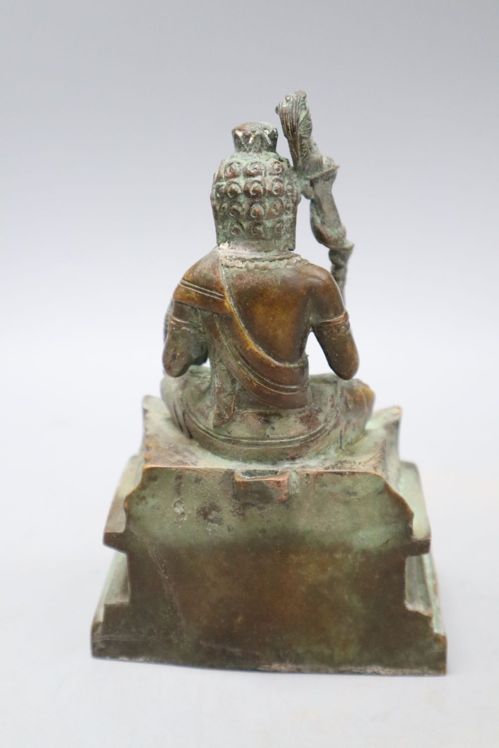 A Himalayan bronze seated figure of a deity, height 16cm